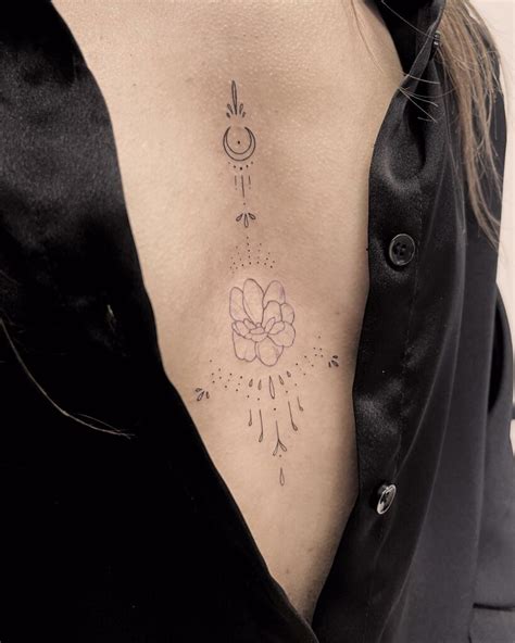 underneath boob tattoos|Under Breast Tattoos for Women: Elegant, Meaningful Designs。